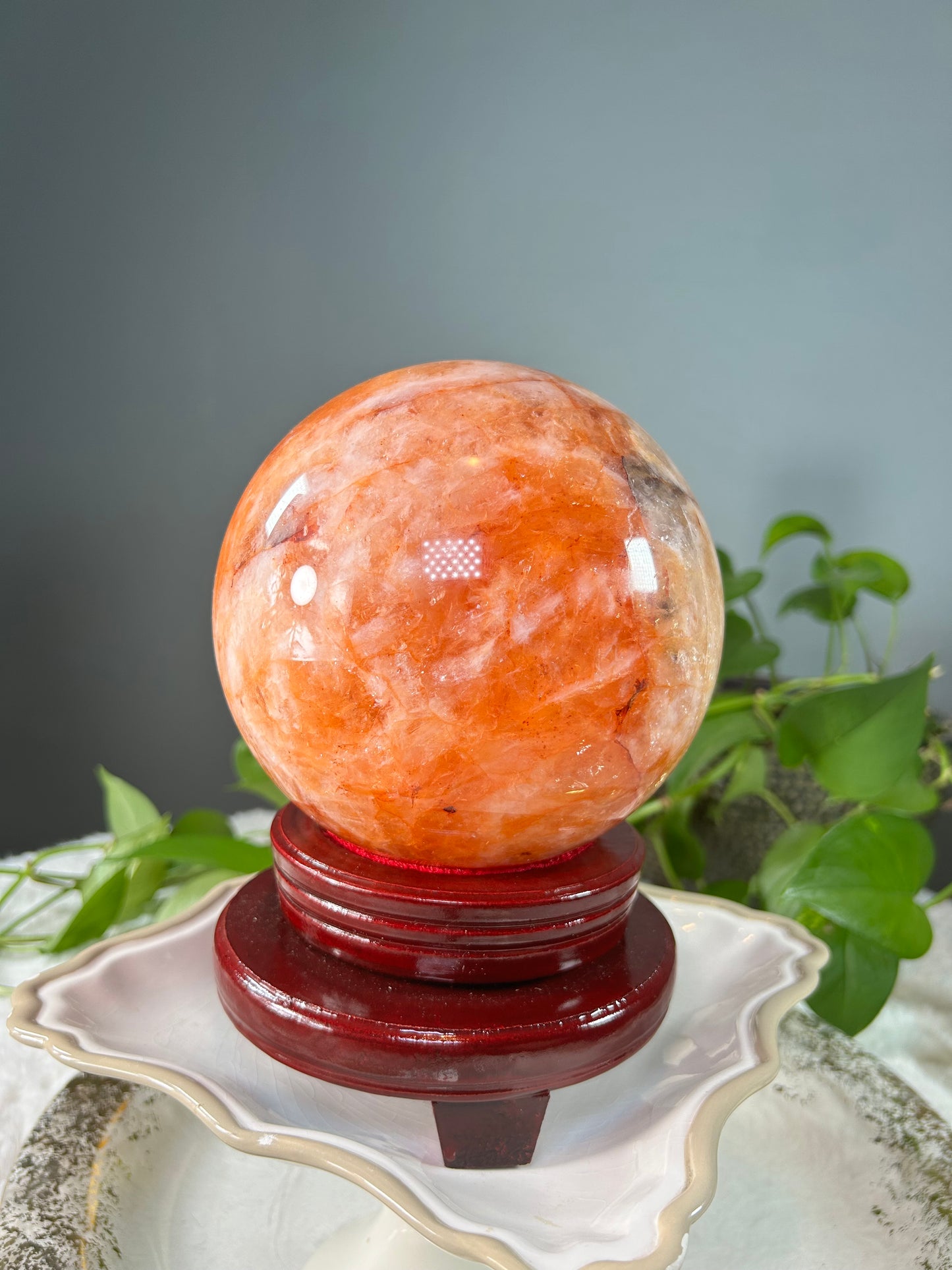 X-Large orange colored fire quartz sphere with red hematoid inclusions- 11.085 pounds (6in wide)