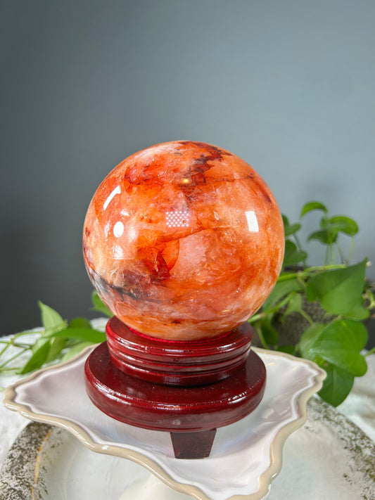 X-Large orange colored fire quartz sphere with red hematoid inclusions- 11.085 pounds (6in wide)